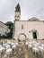 Rows of white chairs stand in front of the church of St. Nicholas in Perast. Montenegro