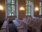 Rows of white chairs in wedding hall