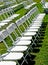 Rows of white folding chairs