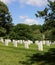 Rows of white tombstones down a hillside at Arlington National Cemetery in Arlington, Virginia