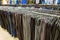 Rows of women trousers hanging on trempels