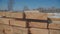 Rows of wooden bars on the street near the production area.