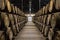 Rows of wooden porto wine barrels in wine cellar Porto