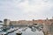 Rows of yachts are moored at the arched fortress walls of Dubrovnik. Croatia