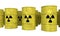 Rows of yellow nuclear waste barrel