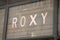 roxy logo brand and text sign on wall facade storefront fashion business