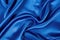 royal blue satin cloth spread flat, close-up texture
