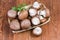 Royal champignon mushrooms in small wooden basket, top view