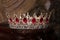 Royal crown with red gems. Ruby, garnet. Symbol of power and authority