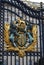 Royal emblem at the gate of Buckingham Palace, London