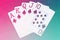 Royal Flush playing cards hand on colorful background