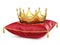 Royal gold crown on red pillow on white