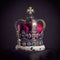 Royal golden crown with jewels on pillow on black background. Symbols of UK United Kingdom monarchy