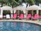 Royal Hawaiian Hotel, Honolulu, Hawaii -4/27/2018 - Lounge chairs and umbrellas by the pool at the Royal Hawaiian Hotel in Hawaii