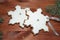 royal icing gingerbread snowflakes cookies on wooden background