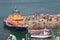 And Royal National lifeboat institute life boat moored in a Cornish harbour