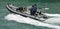 Royal New Zealand navy sailors ride a Zodiak Rigid-hulled inflatable boat in ports of Auckland