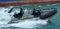 Royal New Zealand navy sailors ride a Zodiak Rigid-hulled inflatable boat in ports of Auckland