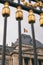 The Royal Palace in Brussels, Belgium. View through the metal fence with golden details. National flag of the Kingdom of