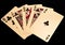 Royal straight flush golden playing cards poker hand