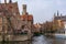 The Rozenhoedkaai canal in Bruges with the classic medieval buildings and Belfry of Bruges