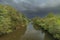 Roznovska Becva river in Valasske Mezirici in autumn cloudy evening