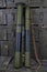 RPG anti-tank rocket propelled grenade launchers with HEAT grenade on army green crate. Text in russian - type of ammunition,