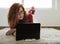 Rred-haired girl with a laptop