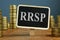 RRSP Registered Retirement Saving Plan and stacks of coins