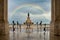 Rua Augusta Arch in the city of Lisbon on a cloudy day and the centered rainbow.