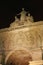 Rua Augusta Arch illuminated at night in Lisbon