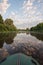 Rubber boat on the river. Fishing rural landscape.