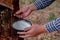 Rubber farmer carefully harvesting the latex from the rubber trees to ensure a bountiful yield