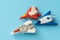 Rubber fighter plane toy display on blue background view