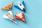 Rubber fighter plane toy display on blue background view