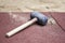 Rubber hammer on brick pavement