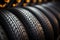 Rubber inventory Close up of bulk car tires in store, tire shop backdrop