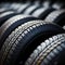 Rubber inventory Close up of bulk car tires in store, tire shop backdrop