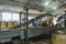 Rubber recycling processing factory on special industrial equipment and conveyor line with cut used car tires. Recycling