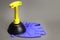 Rubber toilet plunger and gloves. Plumbing work, removal of blockages