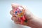 Rubber toy antistress in a woman`s hand on a white background