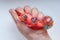 Rubber toy antistress in a woman`s hand on a white background