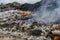 Rubbish hill on fire. Pollution Concepts. Big mountain Garbage Recycling yard