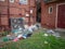 Rubbish scattered around in front of a residential apartment building in Melbourne`s suburban neighborhood. VIC Australia.