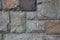 Rubble gray and brown rectangular stone wall, rubblework