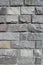 Rubble gray rectangular stone wall, rubblework