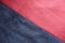 Ruby red and dark blue artificial suede sewn together diagonally