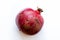 Ruby red pomegranate on white