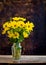 Rudbeckia bright yellow flowers bouquet on dark background
