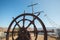 Rudder of an old wooden sailing boat. Steering wheel of a retro vintage ship.